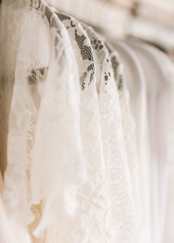 Close-up picture of white lace dresses